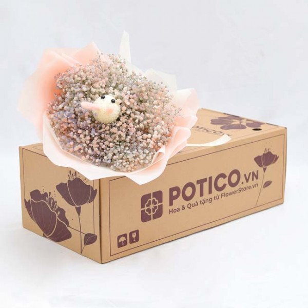 Bunny-shaped bouquet of baby's breath and ping pong mums in a gift box.