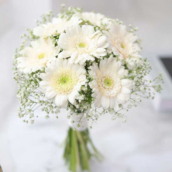 White gerbera daisy and baby's breath bridal bouquet.