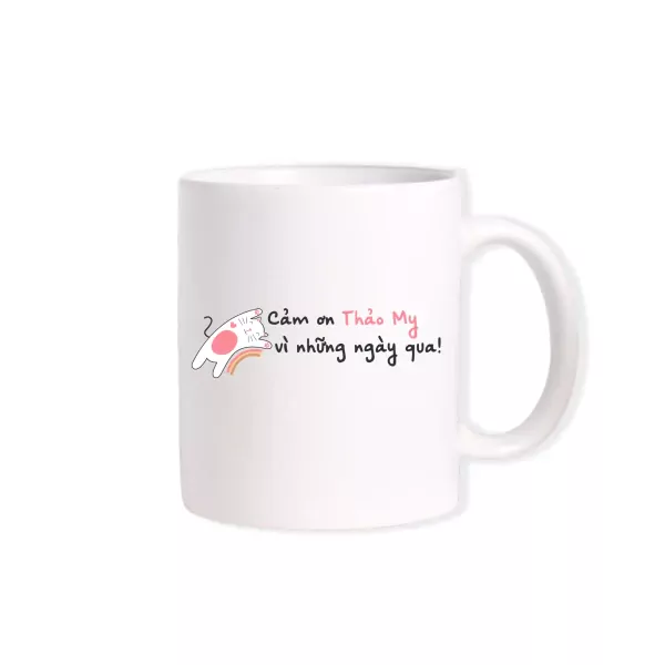 White mug with a cute cat illustration and "Cảm ơn Thảo My vì những ngày qua!" text.
