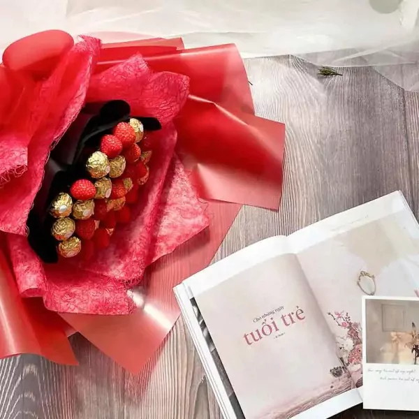 Choco Berry bouquet with strawberries and Ferrero Rocher chocolates, presented with a magazine.