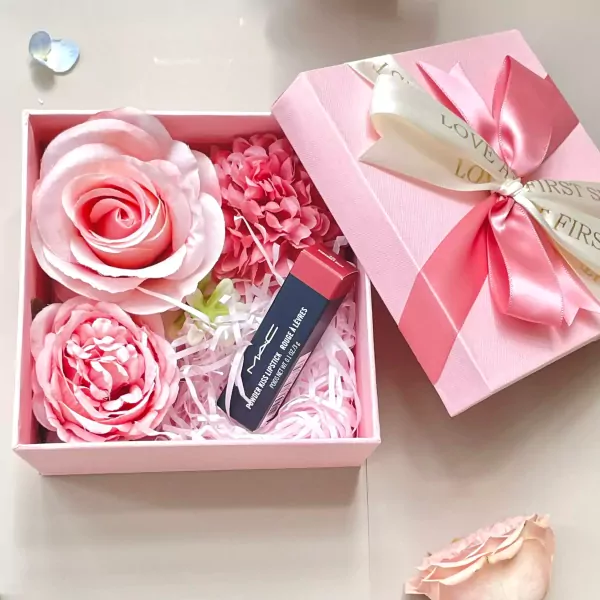 Pink gift box with MAC lipstick and silk roses.