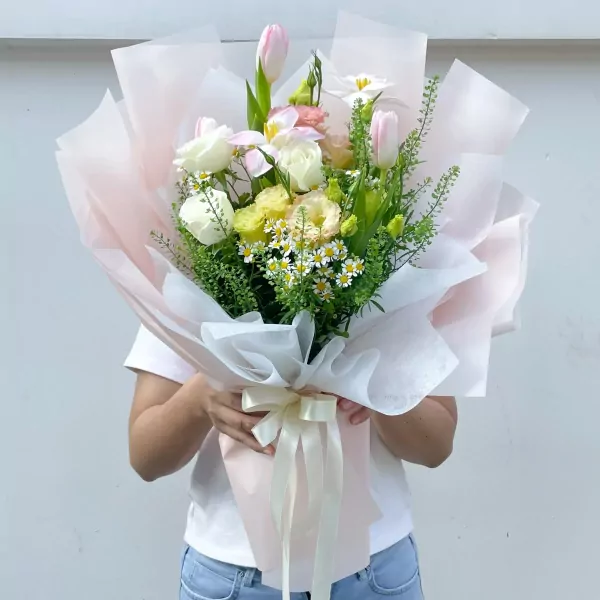 Still Life bouquet with white roses, pink tulips, and small white daisies.