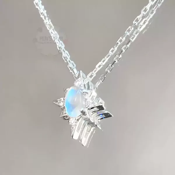 Sparkling crystal sun pendant necklace with a moonstone and small diamonds.