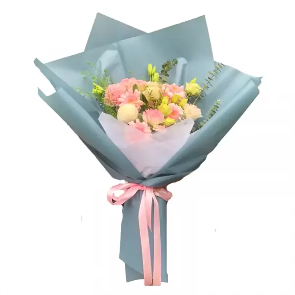 Bouquet of pink and white flowers wrapped in pale blue paper with pink ribbon.