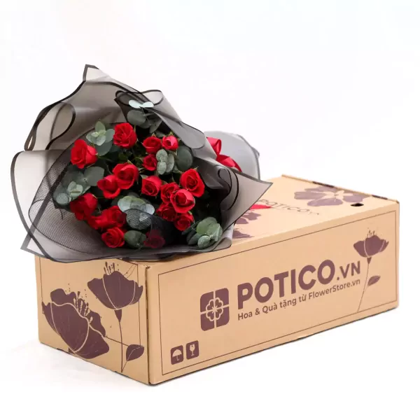 Bouquet of 18 red roses wrapped in black mesh on a cardboard box.