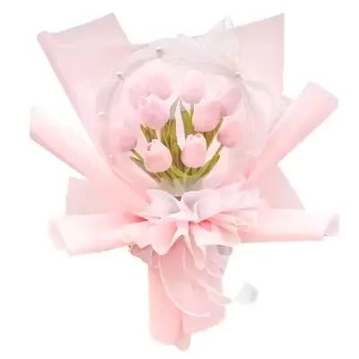 Pink tulip bouquet in a clear bubble with a pink ribbon and pearl accents.
