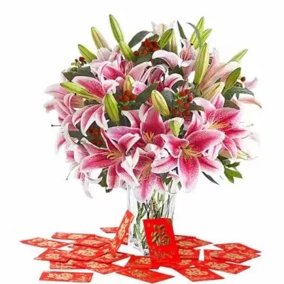Bouquet of pink lilies with red berries and red envelopes.