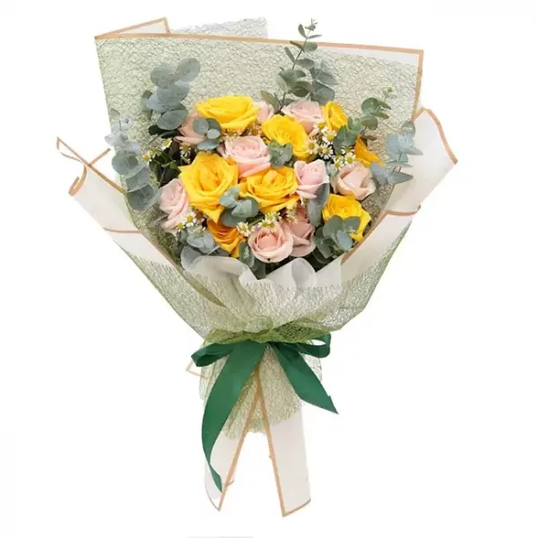 Bouquet of yellow and cream roses with eucalyptus leaves, tied with a green ribbon.