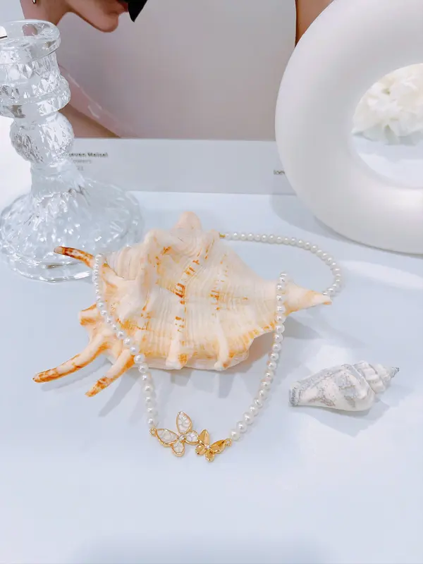 Pearl necklace with butterfly charm 4