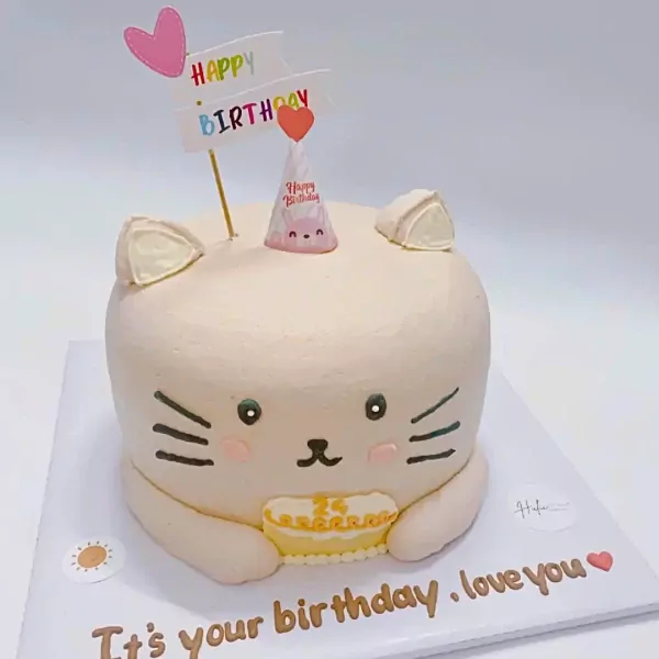 Cute cat cake with "Happy Birthday" topper and "It's your birthday. love you" text.