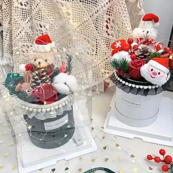 Christmas gift boxes with teddy bears, Santa Claus, roses, and pinecones.
