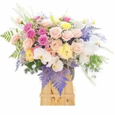 A mixed flower arrangement in a wooden box with pink roses, cream roses, white orchids, and purple accents.