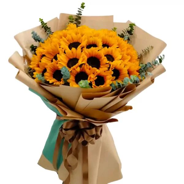 Bouquet of 36 bright sunflowers with greenery, wrapped in brown paper and tied with a bow.