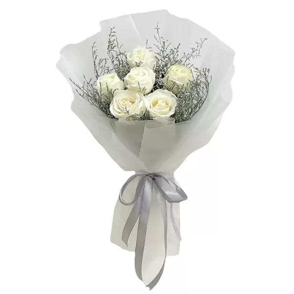 Bouquet of white roses with grey ribbon and decorative foliage.