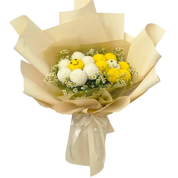 Bouquet of yellow and white ping pong chrysanthemums with daisy-like flowers, wrapped in beige paper with a ribbon.