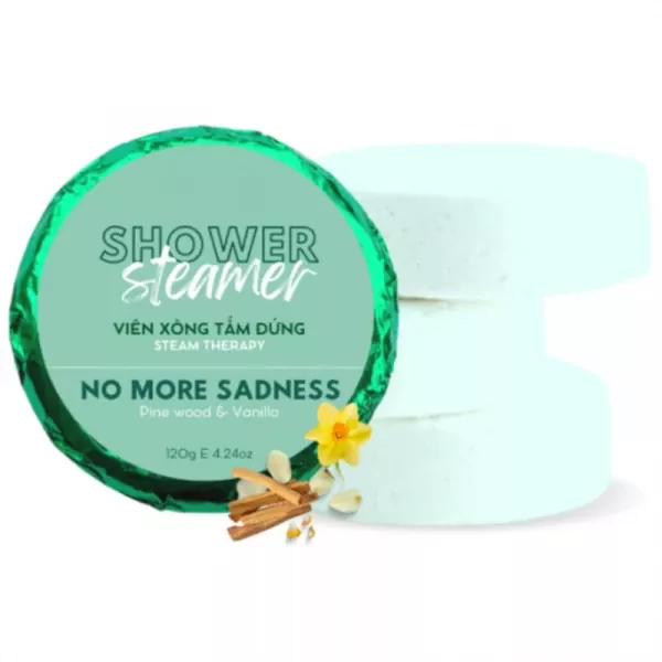 Shower steamers in packaging with pine wood and vanilla scents, beside bath bombs.