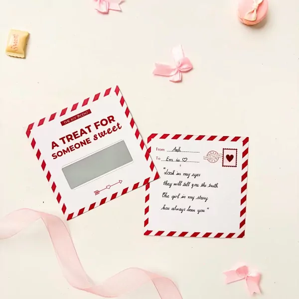 Scratch-off gift card and love note with pink bows and ribbon.