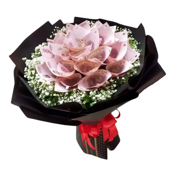Money bouquet made of folded pink bills and baby's breath, wrapped in black paper with a red ribbon.