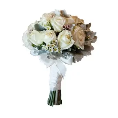 Bridal bouquet of white roses with silver-dusted foliage and a white satin ribbon.