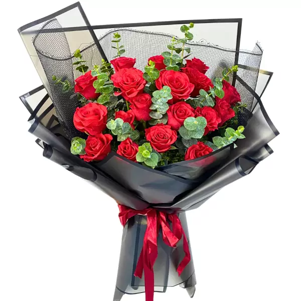 A bouquet of 18 red roses with eucalyptus leaves, wrapped in black paper and tied with a red ribbon.