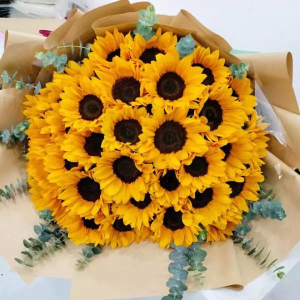 Bouquet of sunflowers with eucalyptus.