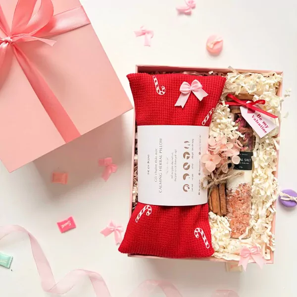 Valentine's gift box with red herbal pillow, bath salt, and dried flowers.