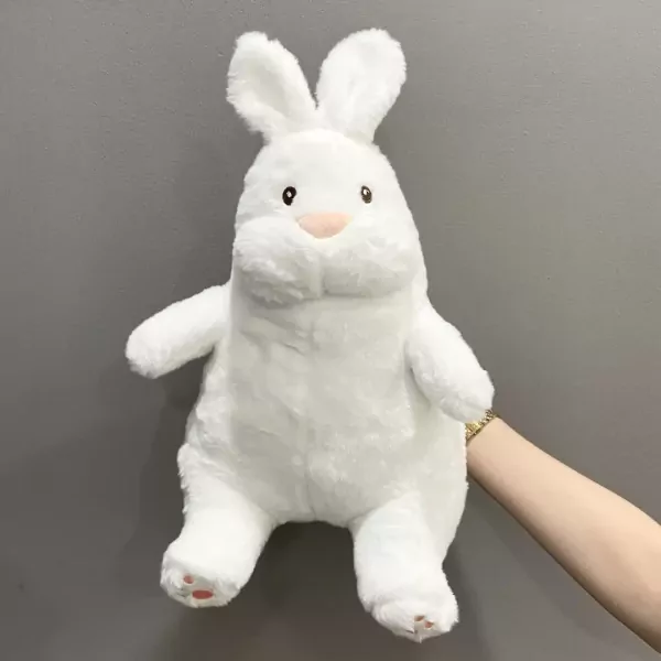 White plush bunny rabbit with pink accents on its nose and paws.