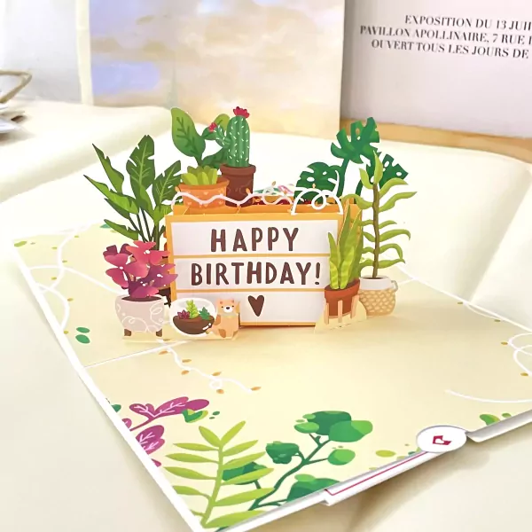 3D pop-up birthday card with plants and "Happy Birthday!" message.