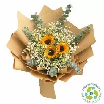 A bouquet of sunflowers, baby's breath, and eucalyptus, wrapped in brown paper.