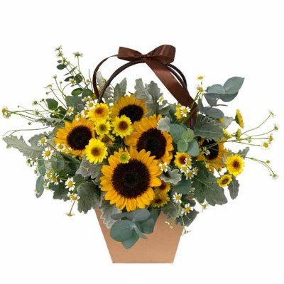Basket arrangement of sunflowers, daisies, and eucalyptus with a brown ribbon.