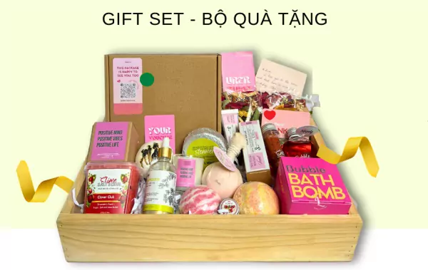 Gift set in a wooden crate with bath bombs, body oil, scrub, and candle.