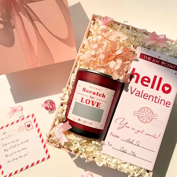Valentine gift set with candle, dried flowers, and "hello Valentine" card.