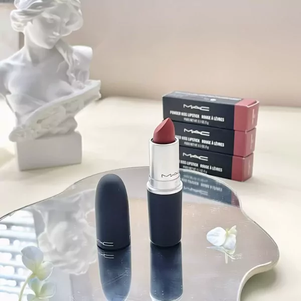 MAC lipstick in Blooming Forest with gift box and floral decor.