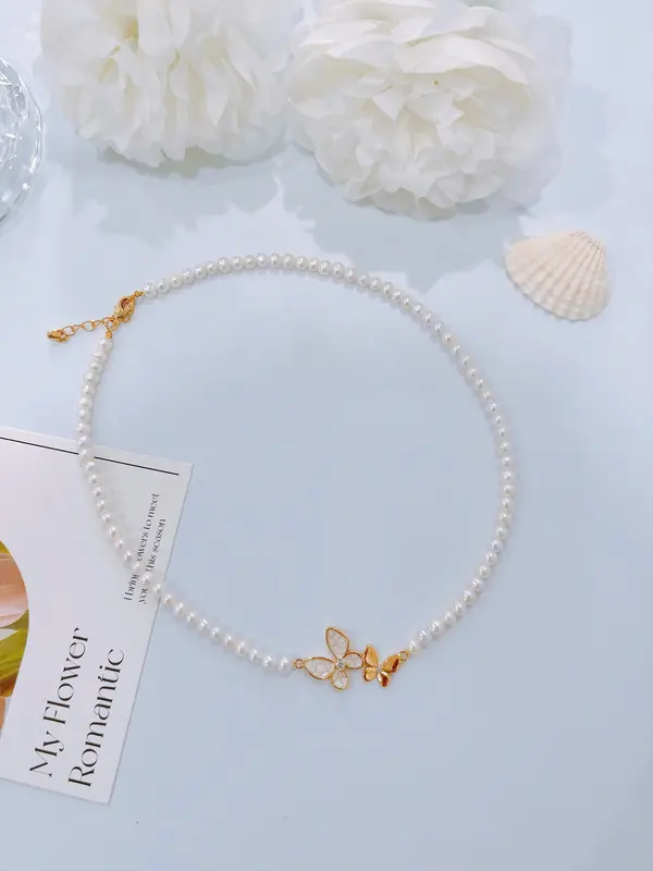 Pearl necklace with butterfly charm 2