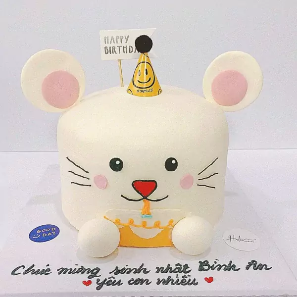Cute white mouse cake with pink cheeks, holding a birthday cake with a candle.