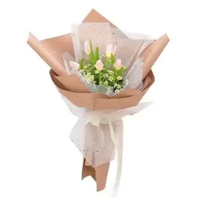 Pink tulip and tanacetum bouquet wrapped in brown and white paper with a ribbon.