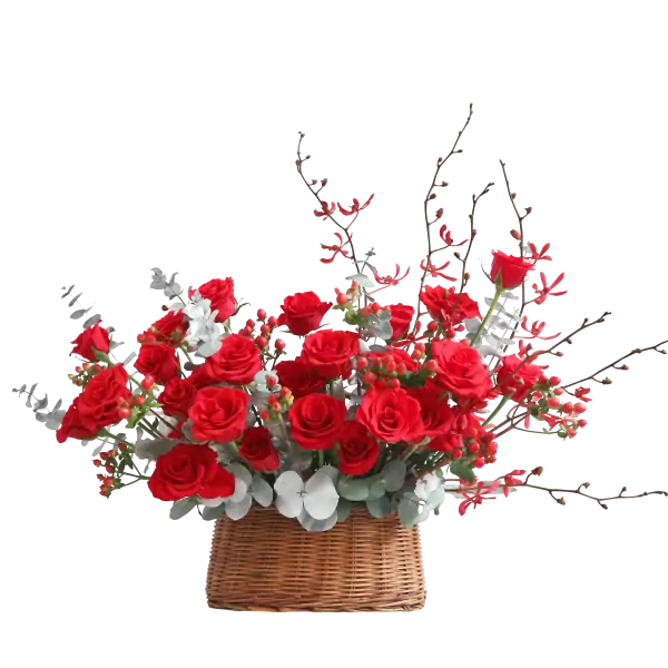 Basket of red roses with greenery and accent flowers, arranged in a half-round shape.