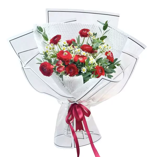 Bouquet of red ranunculus and white tana flowers, wrapped in white paper with a burgundy ribbon.