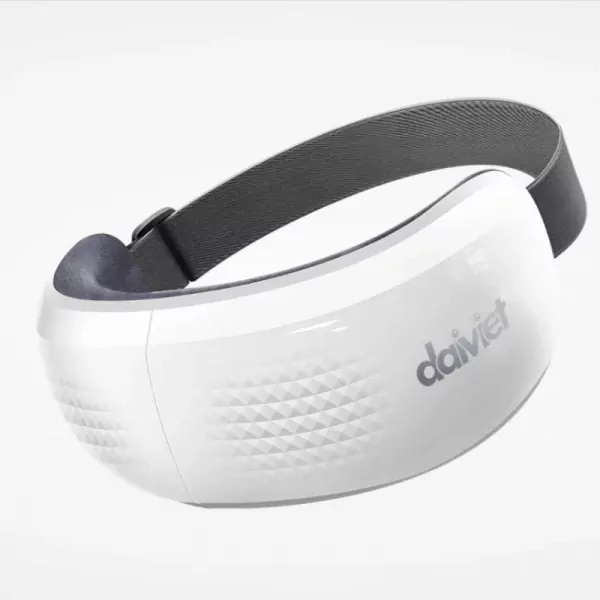 White eye massager with gray strap and textured sides.